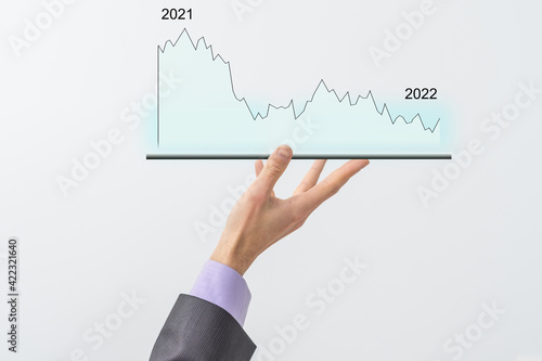 man's hand holding a tablet with growth chart. Analysis concept