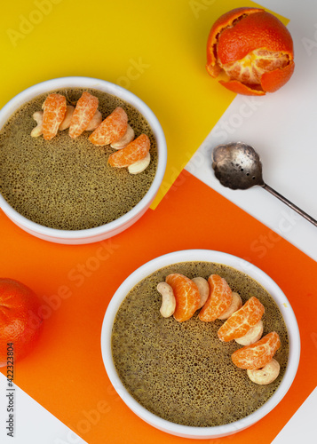 Traditional Sri Lankan coconut milk pudding Watalappan garnished with cashew nuts and tangerine wedges. photo