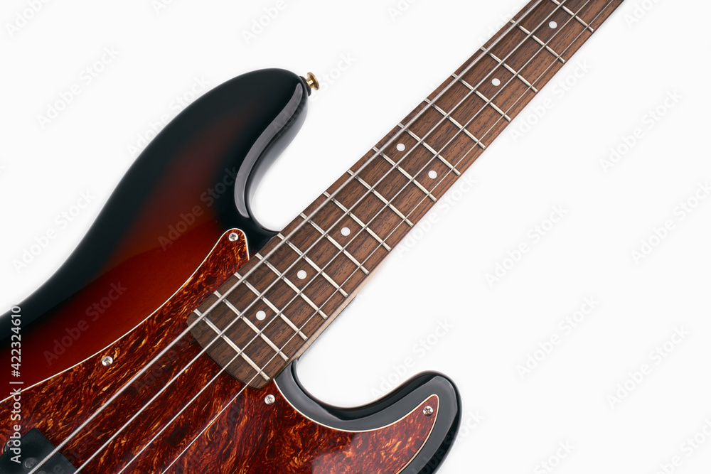 Obraz premium Metallic volume treble guitar bass knobs. Electric guitar. Red electric bass guitar close-up. Musical instrument. Music. Four strings. Grif.