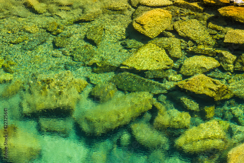 The stones under the pond, close-up as a background.