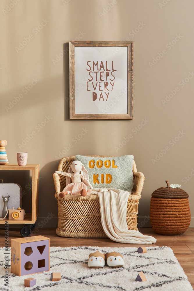 Stylish scandinavian kid room interior with toys, teddy bear, plush animal  toys, rattan sofa, furniture, decoration and child accessories. Brown  wooden mock up poster frames on the wall. Template Stock Photo |