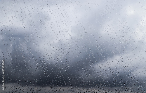 Water drops on window glass, closeup. Rainy weather