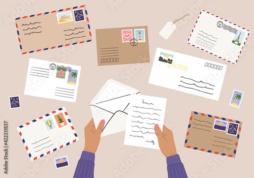 Flat lay illustration of envelopes, letters, postage stamps, stationery and tan female hands holding mails. Workspace top view. Hand drawn vector illustration