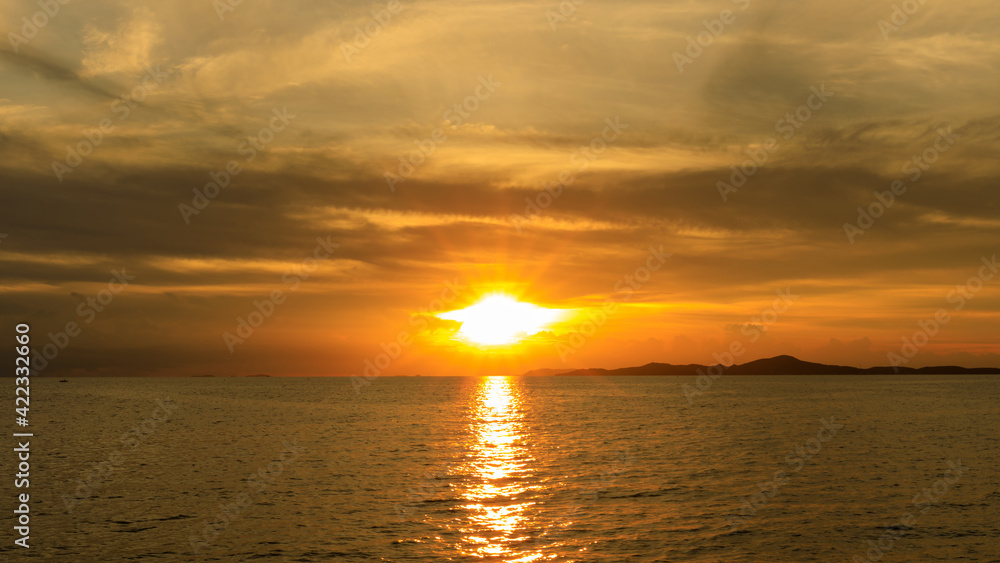 Sunset or evening twilight time over sea water or ocean and island. Sunset or evening twilight time over sea water or ocean and island.