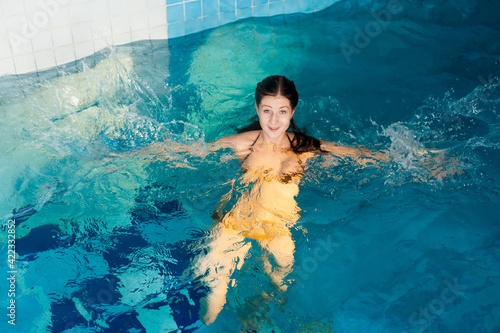 Attractive girl in swimming pool © Aikon