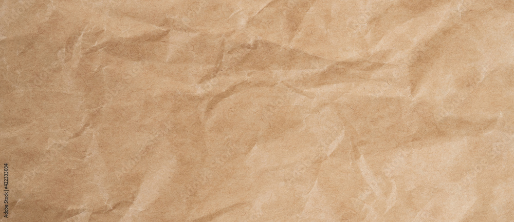 Close up crumpled brown paper texture and background with copy space