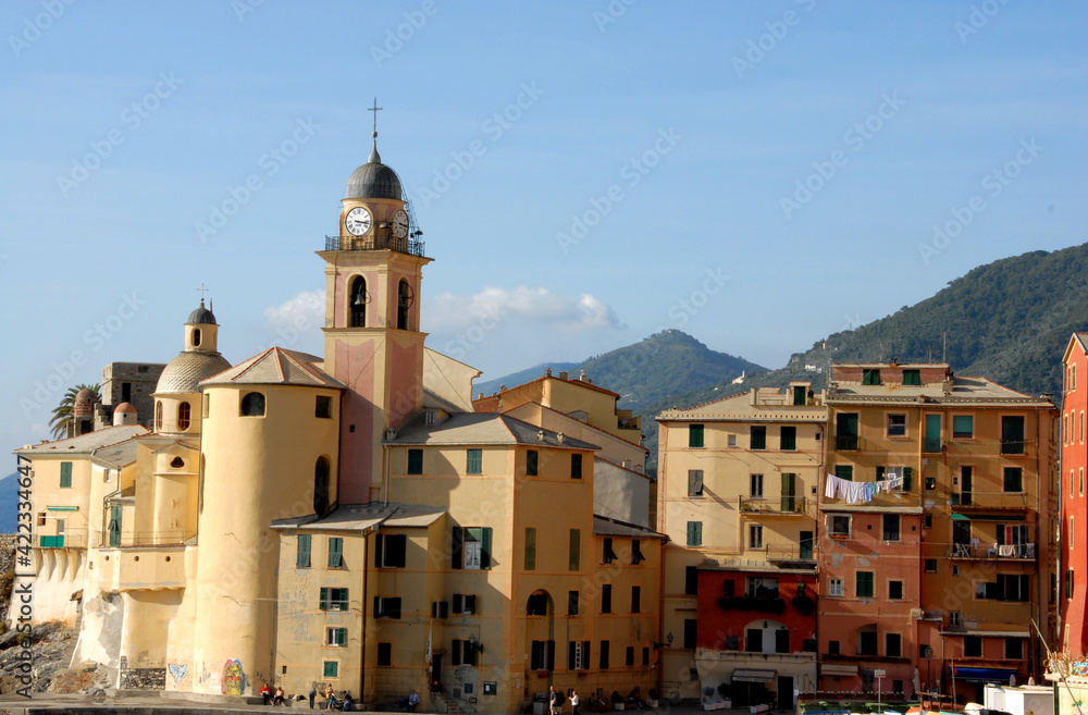Camogli is a typical seaside village and tourist center known for its marina, church and tall colorful buildings on the seafront.