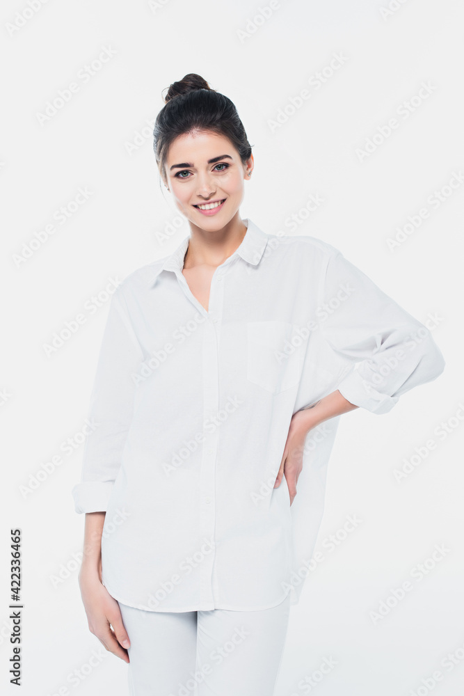 Young woman in white shirt smiling at camera isolated on white Young woman in white shirt smiling at camera isolated on white
