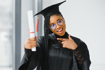 pretty african female college graduate at graduation