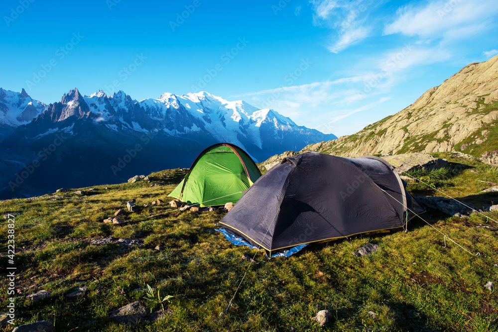 Two tents in the mountains in the Alps, Europe (still life coach, company, friendship, background - concept)