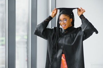 pretty african female college graduate at graduation