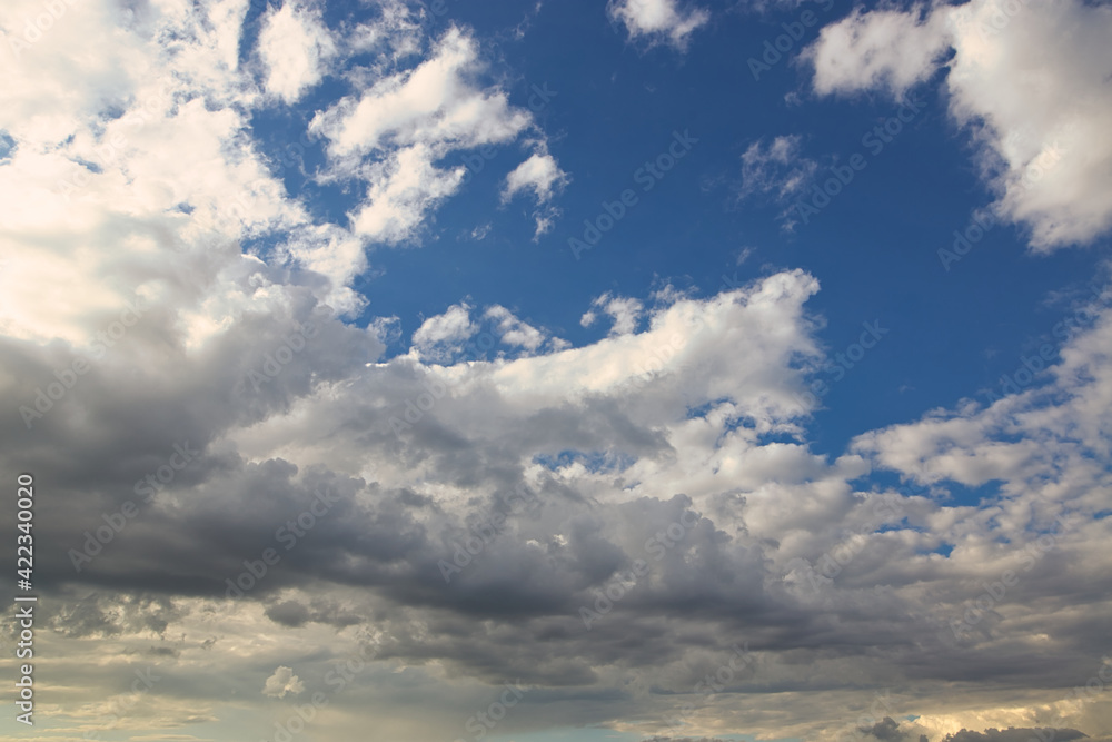 dramatic blue sky with rays and white clouds dramatic blue sky with rays and white clouds