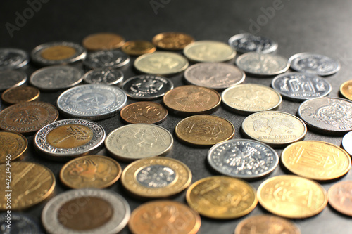 Many coins on a black background