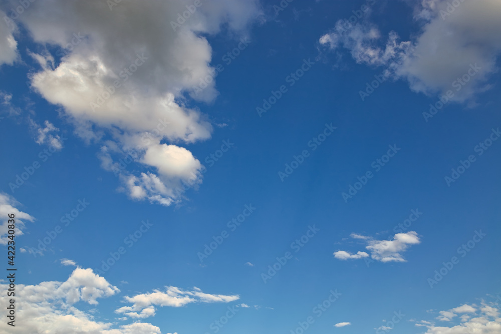 dramatic blue sky with rays and white clouds dramatic blue sky with rays and white clouds