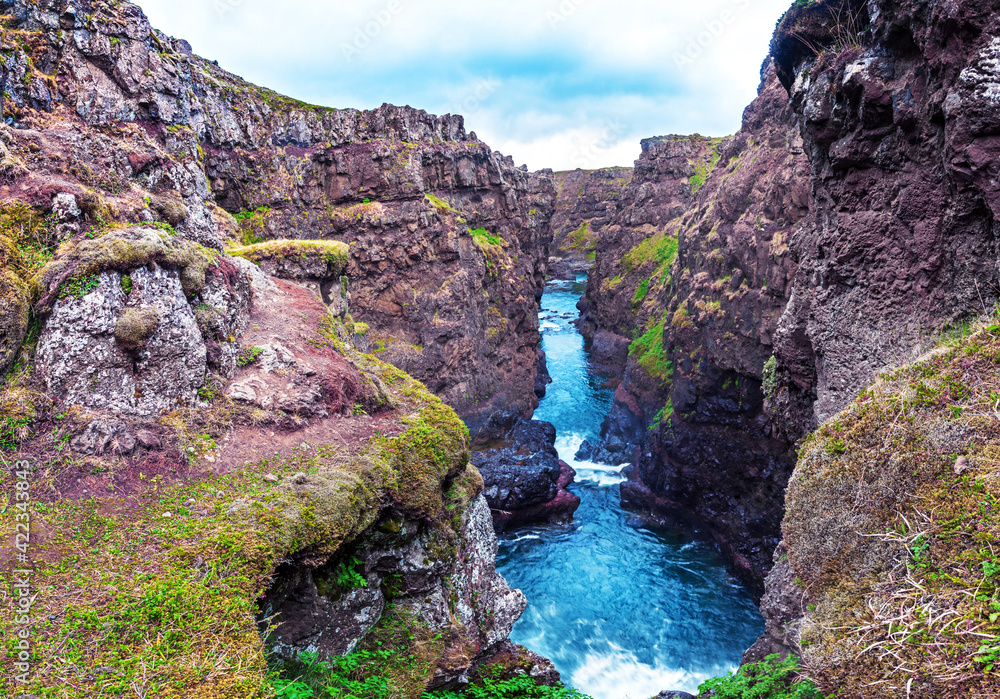 Beautiful magical landscape with a canyon Kolugljufur with water between the rocks in Iceland. Exotic countries. Amazing places.