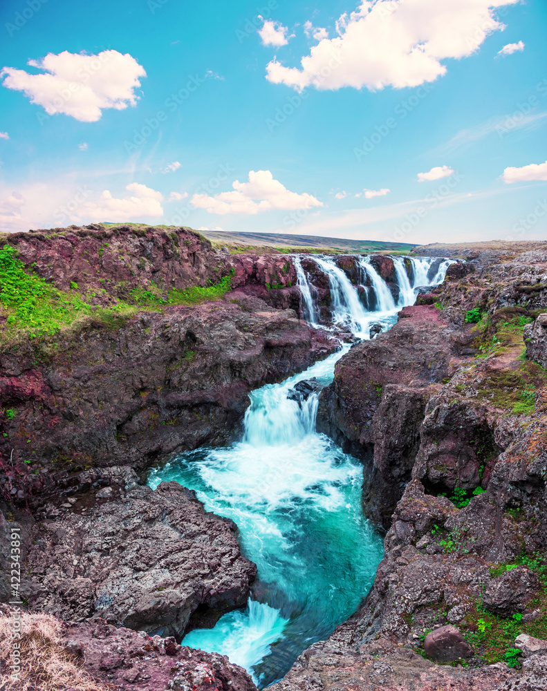 Beautiful magical landscape with waterfall in a canyon Kolugljufur with water between the rocks in Iceland. Exotic countries. Amazing places.