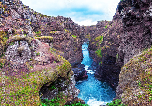Obraz na płótnie Beautiful magical landscape with a canyon Kolugljufur with water between the rocks in Iceland. Exotic countries. Amazing places. w salonie