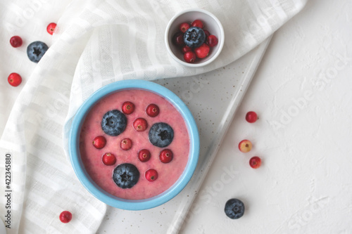 Fresh blueberry smoothie on a white background