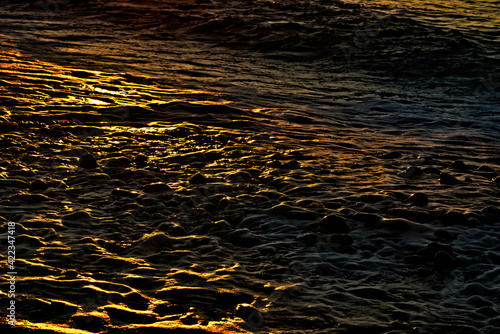 Beautiful yellow sunset reflected in the sea