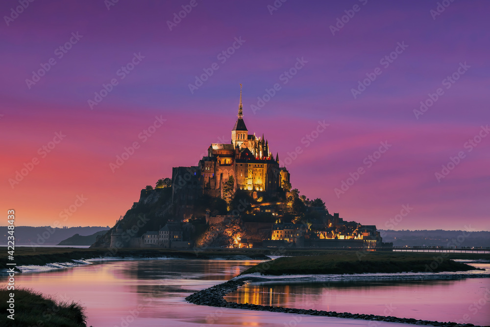 Mont Saint-Michel, Normandy, France; March 21, 2021 - A view of Mont Saint-Michel at dusk, Normandy, France