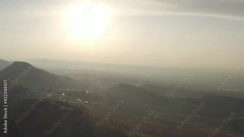 Drone video of a mystical sunrise, sunset in the mountains. Mountain ranges in the haze in the sunlight in a beautiful landscape. Aerial view Turkey. Drone video of a mystical sunrise, sunset in the mountains. Mountain ranges in the haze in the sunlight in a beautiful landscape. Aerial view Turkey.