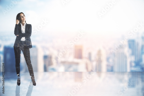 Business decision concept with pensive businesswoman on abstract city background with empty place for your text. Double exposure
