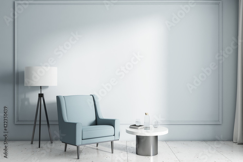 Sunny stylish cabinet zone with modern light wall  sky color armchair  white lamp with black tripod  coffee table on marble floor