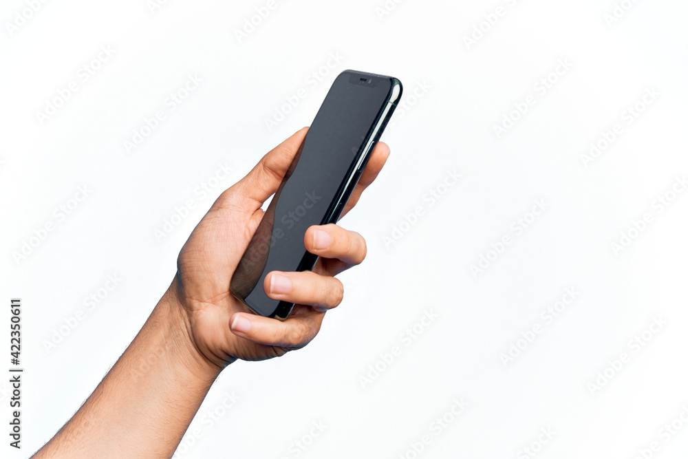 Hand of caucasian young man holding smartphone showing screen over isolated white background Hand of caucasian young man holding smartphone showing screen over isolated white background