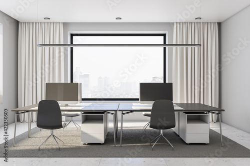 Grey shades interior design of coworking office with light curtain on big windows, dark furniture on marble floor