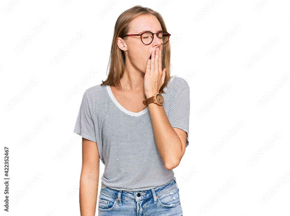 Beautiful young blonde woman wearing casual clothes and glasses bored yawning tired covering mouth with hand. restless and sleepiness. Beautiful young blonde woman wearing casual clothes and glasses bored yawning tired covering mouth with hand. restless and sleepiness.
