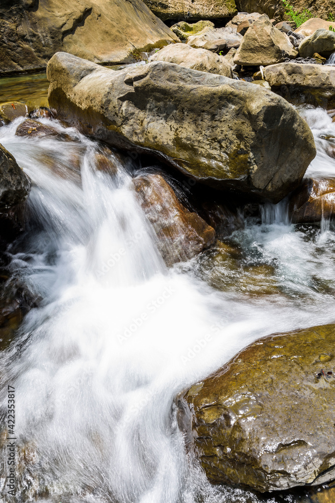The stones under the waterfall, close-up waterfall as background. The stones under the waterfall, close-up waterfall as background.