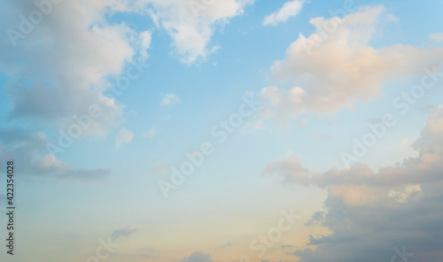Beautiful view of blue sky with clouds at sunrise. Partly cloudy. Colorful sunset. Natural sky background texture, beautiful color.
