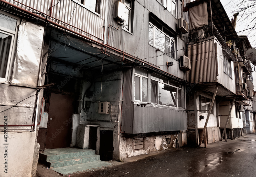 Batumi, Georgia - March 10, 2021: Entrance of an old house in a poor house