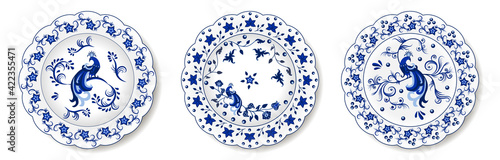 Set of porcelain plates with traditional blue on white design in Chinese style. Floral ornament with exotic flower and peacocks. Vector illustration