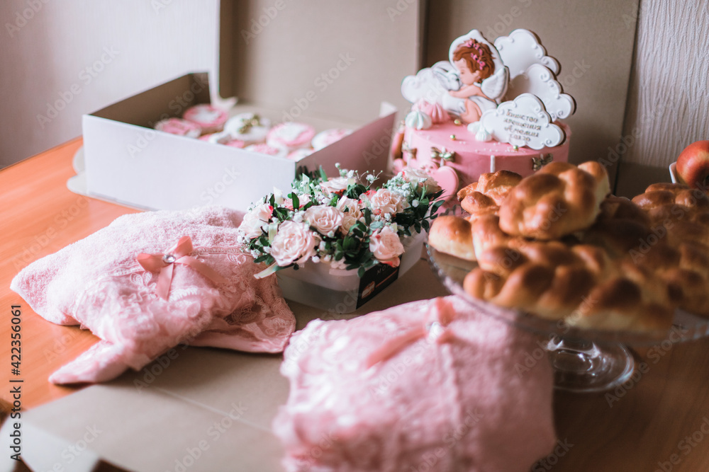 A lot of sweets on the table for the holiday. Pies, muffins, cake, and flowers A lot of sweets on the table for the holiday. Pies, muffins, cake, and flowers