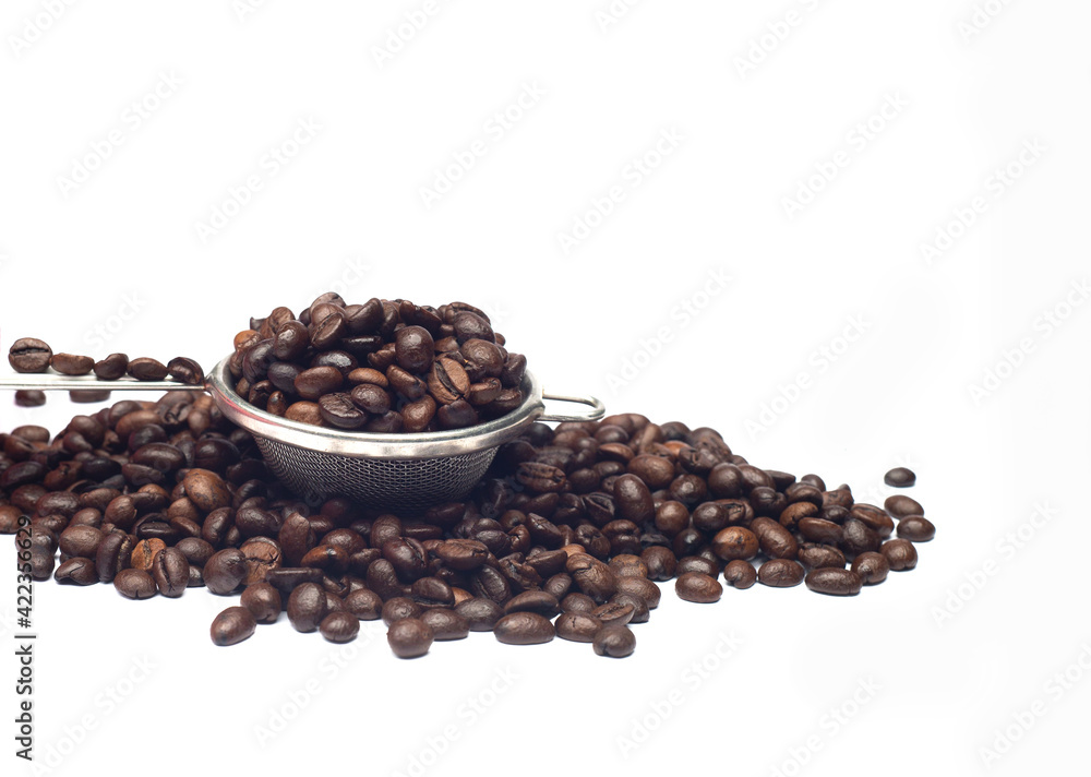 dark roasted coffee beans on a white background dark roasted coffee beans on a white background