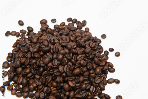 dark roasted coffee beans on a white background