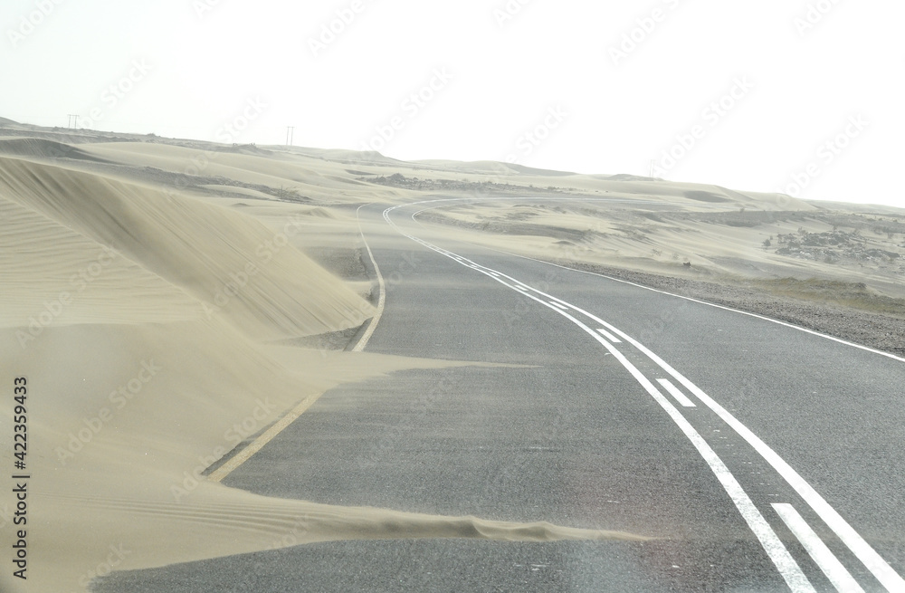 A sandstorm coveres the street in namibia A sandstorm coveres the street in namibia