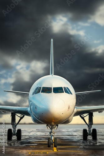 modern airplane against a d...