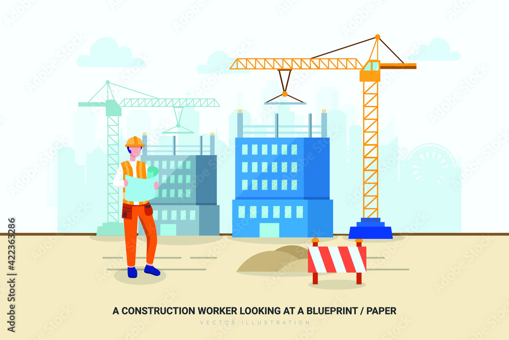 A construction worker looking at a blueprint / paper