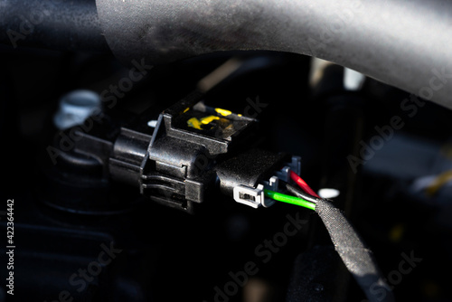 Auto electrician close-up. Car service. Diagnostics of electrical wiring. Car wire connector. 