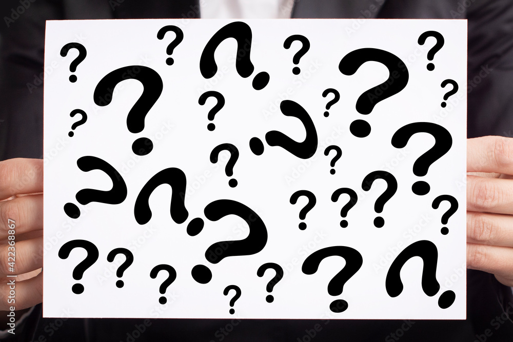 Question marks on white paper. Motivation, inspiration concept Question marks on white paper. Motivation, inspiration concept