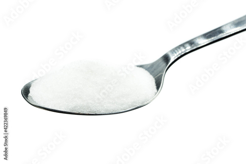 Sugar on spoon isolated on white background