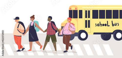 Children crossing road on crosswalk. Group of cute schoolchildren pedestrians on street zebra