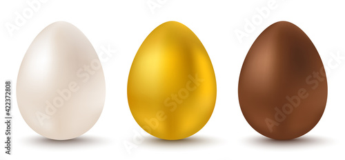 White, golden and chocolate eggs for Easter.