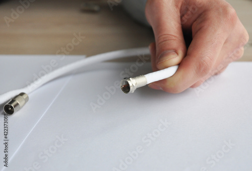 Foto Replacing and repairing a coaxial cable, TV cable connector