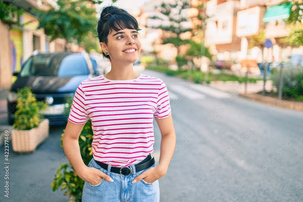 Young hispanic girl smiling happy walking at the city. Young hispanic girl smiling happy walking at the city.