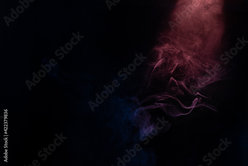 Blue and pink steam on a black background.