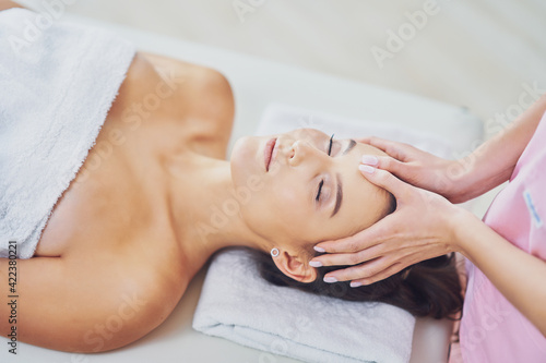 Wallpaper Mural Adult woman during relaxing massage in spa Torontodigital.ca