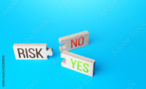 Risk puzzles with two Yes and No combinations connections. Business risk management concept. Forecasting and planning possible profit or consequences. Investment security. Company stress tolerance
